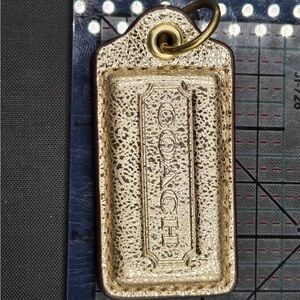 Coach Metallic Gold Tag